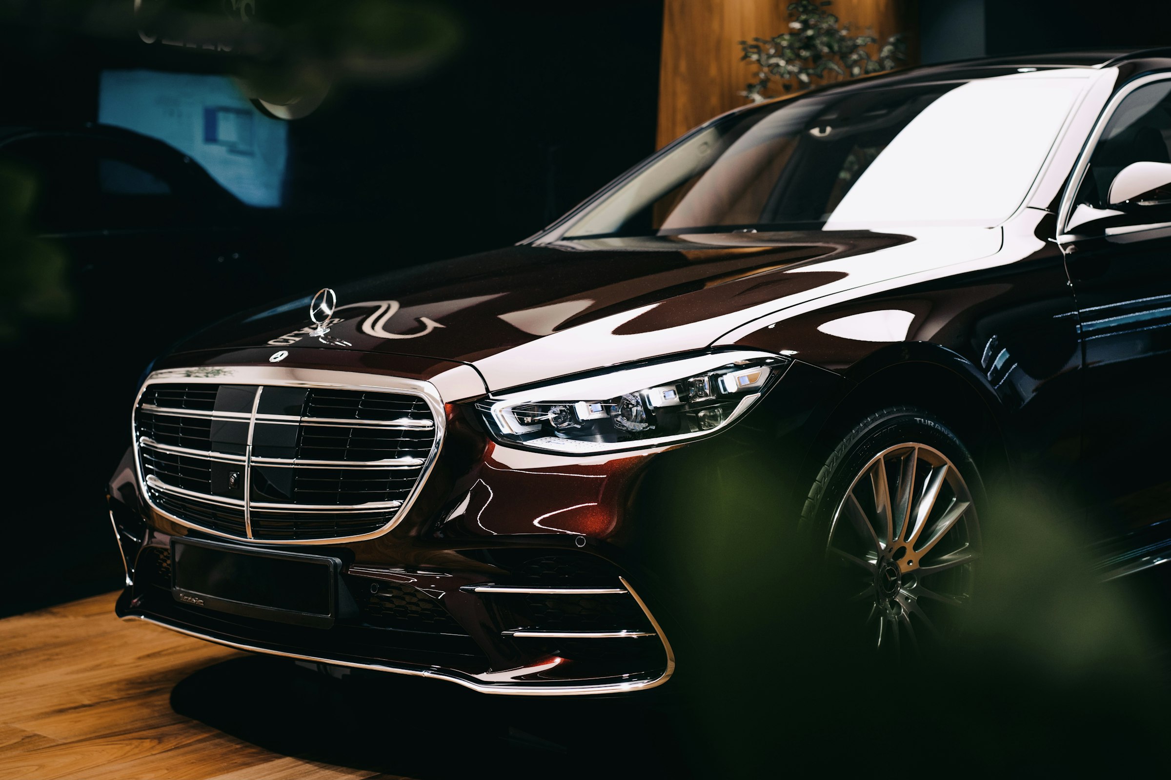 Mercedes S-Class in a dark showroom