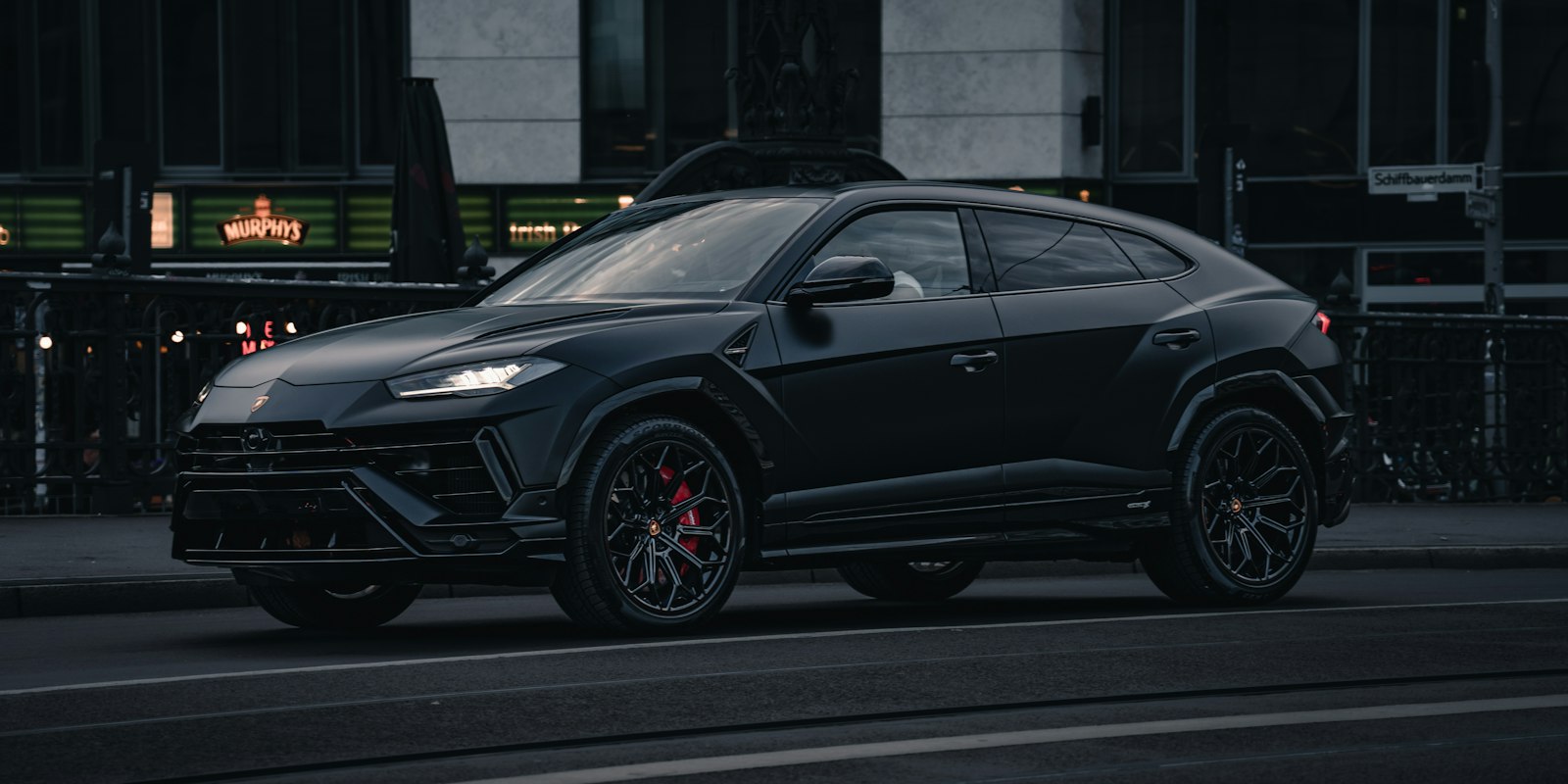 Black Lamborghini Urus parked in the city